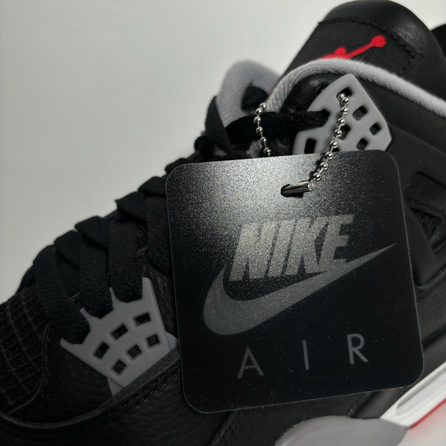 Nike Air Jordan 4 Retro Bred Reimagined Tag